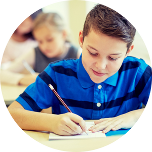 boy writing with pencil